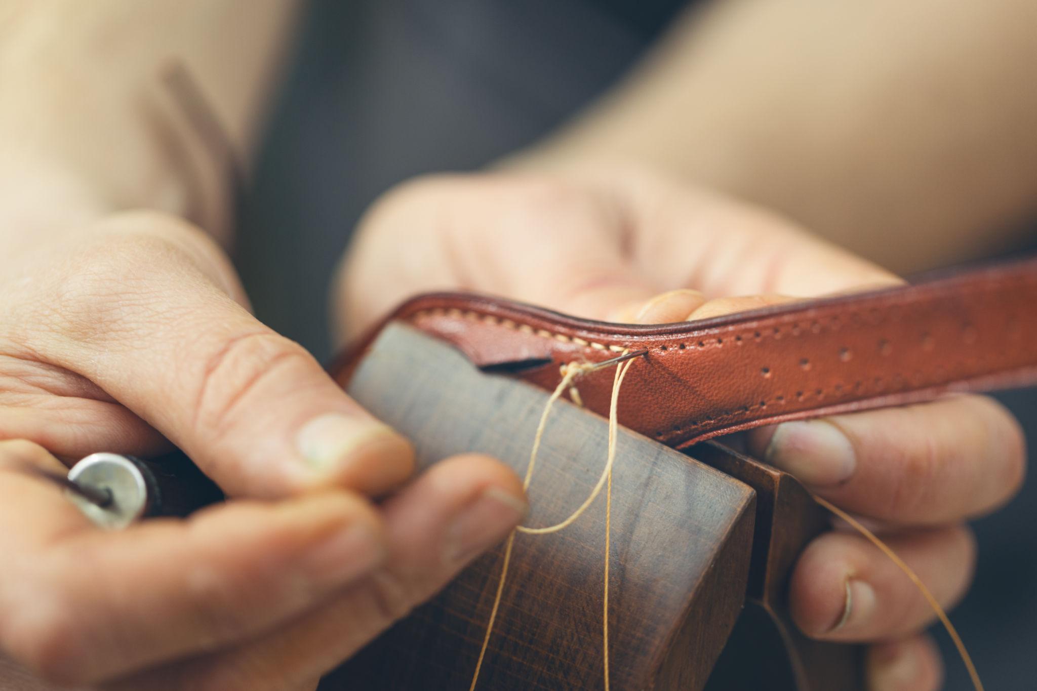 Craftsman working with leather in a workshop